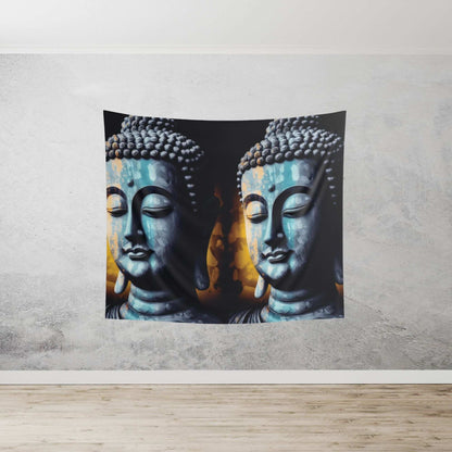 A serene Blue Buddha Indoor Wall Tapestry by Printify, featuring peaceful faces with closed eyes and a blend of blue and orange hues, beautifully enhances a light gray textured wall above a wooden floor. This creates an ideal tranquil atmosphere for meditation spaces.