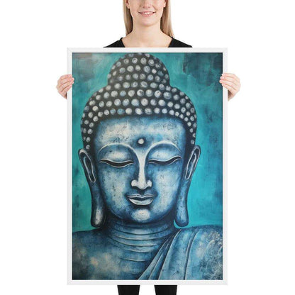 A woman with a bright smile is holding a white oak framed poster depicting a serene blue Buddha head against a textured teal background, blending spiritual calm with rich, modern colors.