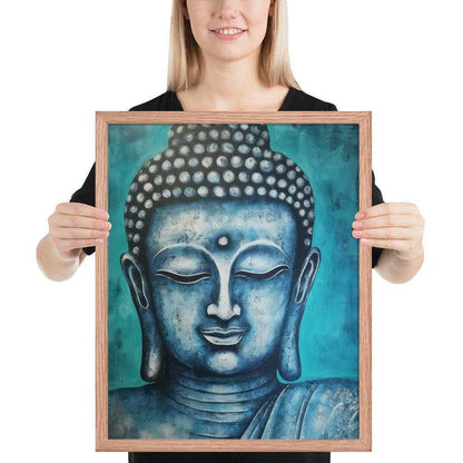 A woman with a bright smile is holding a red oak framed poster depicting a serene blue Buddha head against a textured teal background, blending spiritual calm with rich, modern colors.