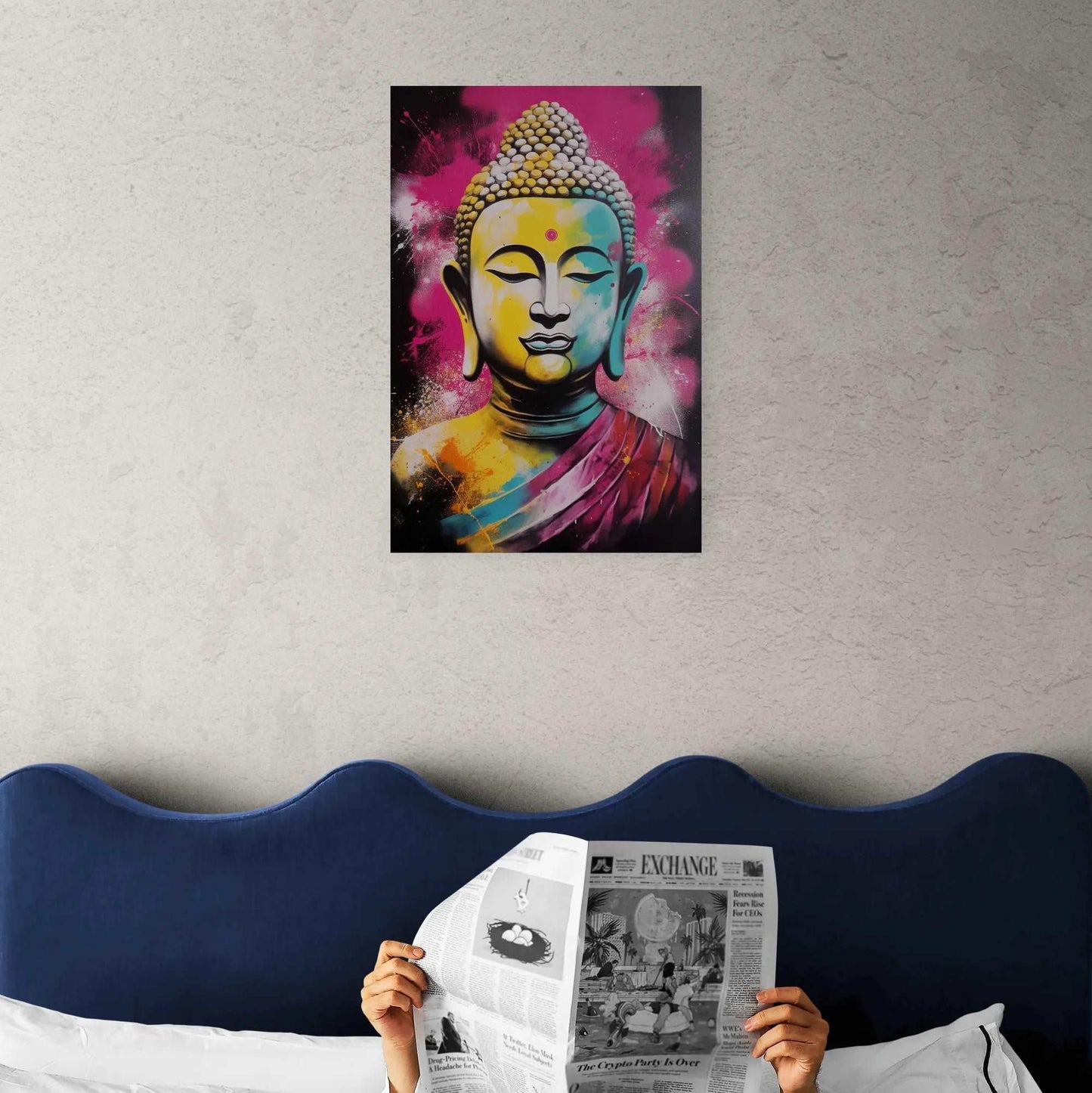 Person reading a newspaper in bed with a colorful Buddha painting in the background, creating a vibrant and thoughtful ambiance in a bedroom setting.