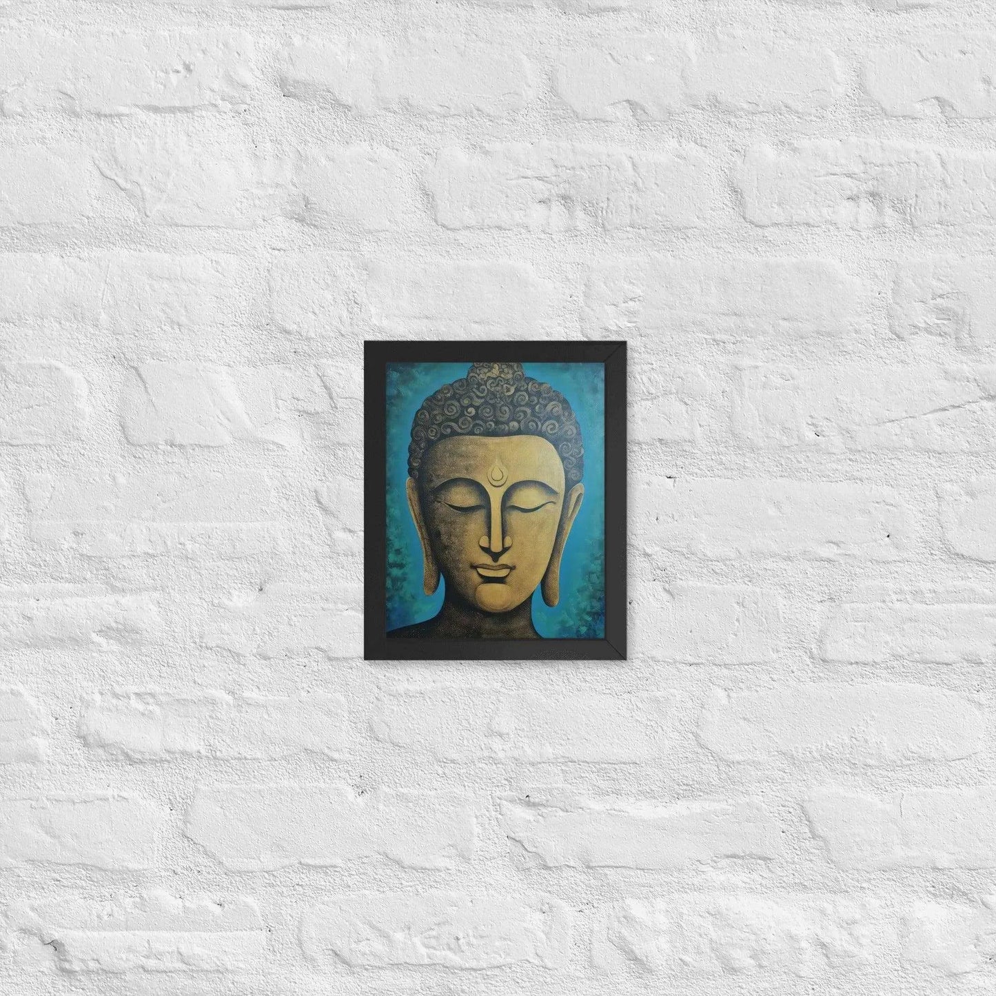 A black oak Golden Buddha Framed Print hangs on a white brick wall, showcasing a serene golden Buddha head with a stylized turquoise backdrop, creating an atmosphere of calm and contemplation within the space.