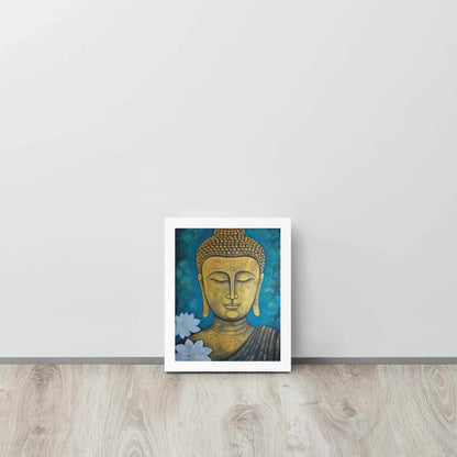 A golden Buddha Painting portrait with a serene expression is framed in white oak, set against a deep blue floral backdrop, placed on a light wooden floor by a white wall. This artwork merges spiritual iconography with a natural motif.