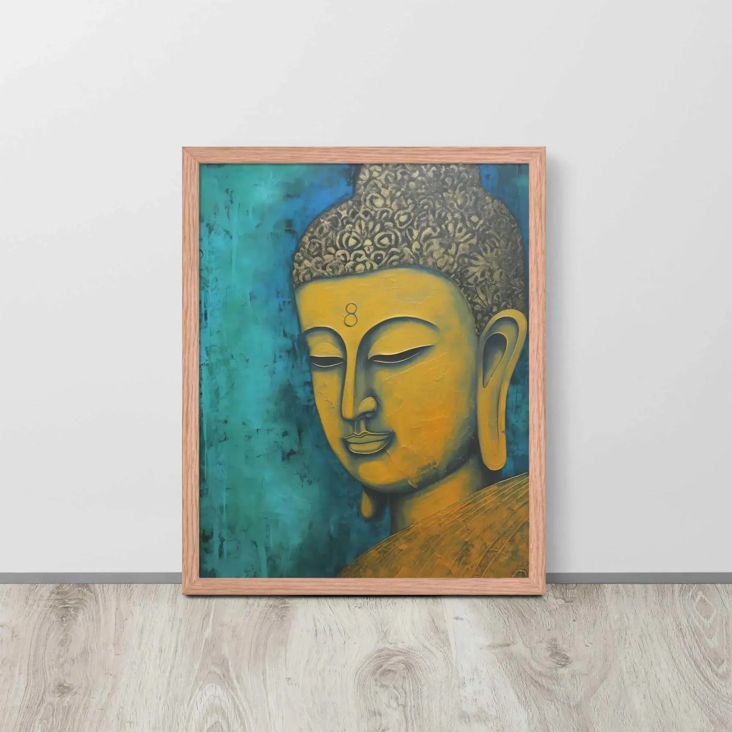 A red oak framed Golden Buddha Painting poster featuring a close-up of a serene Buddha's face with a golden complexion against a textured turquoise background is presented on a light wooden floor beside a white wall, embodying a blend of spirituality and modern art aesthetics.