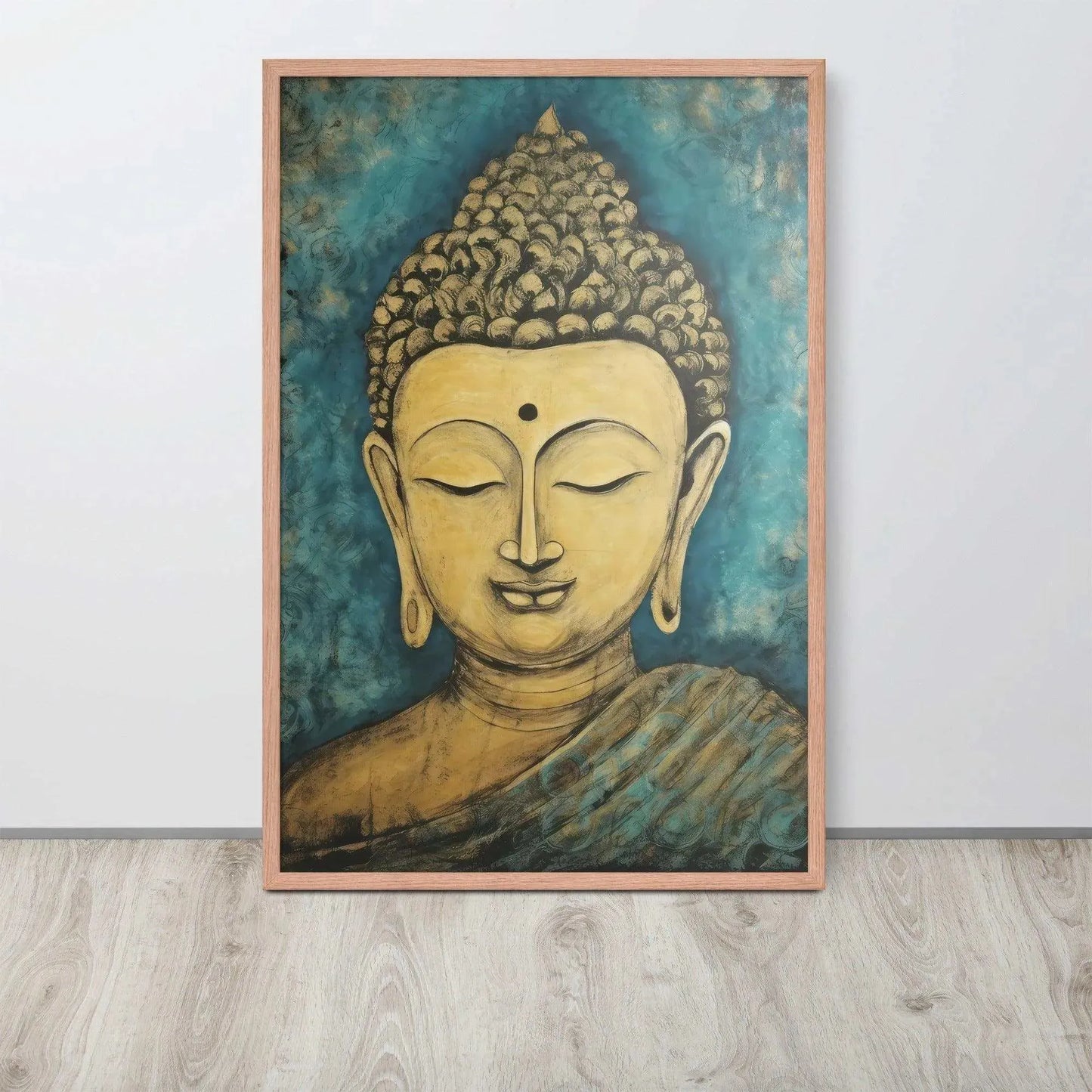 A red oak framed poster on a light wooden floor features a Golden Buddha Zen Wall Art with a tranquil expression, set against an abstract blue textured background, conveying a sense of peace and introspection beside a white wall.