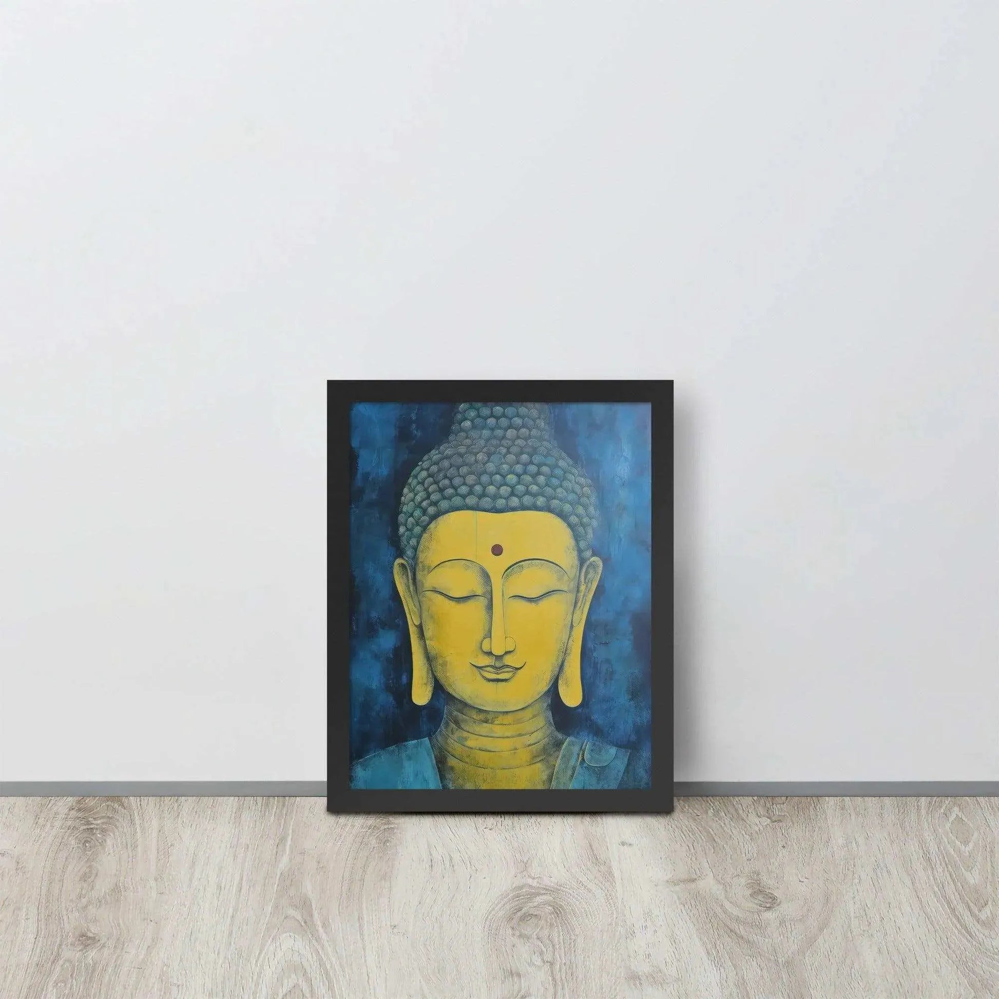 A black-Golden Happy Buddha Framed Print placed on a wooden floor against a white wall features a golden Buddha head with a serene expression, set against a deep blue textured background, creating a focal point of tranquility and spirituality in the room.