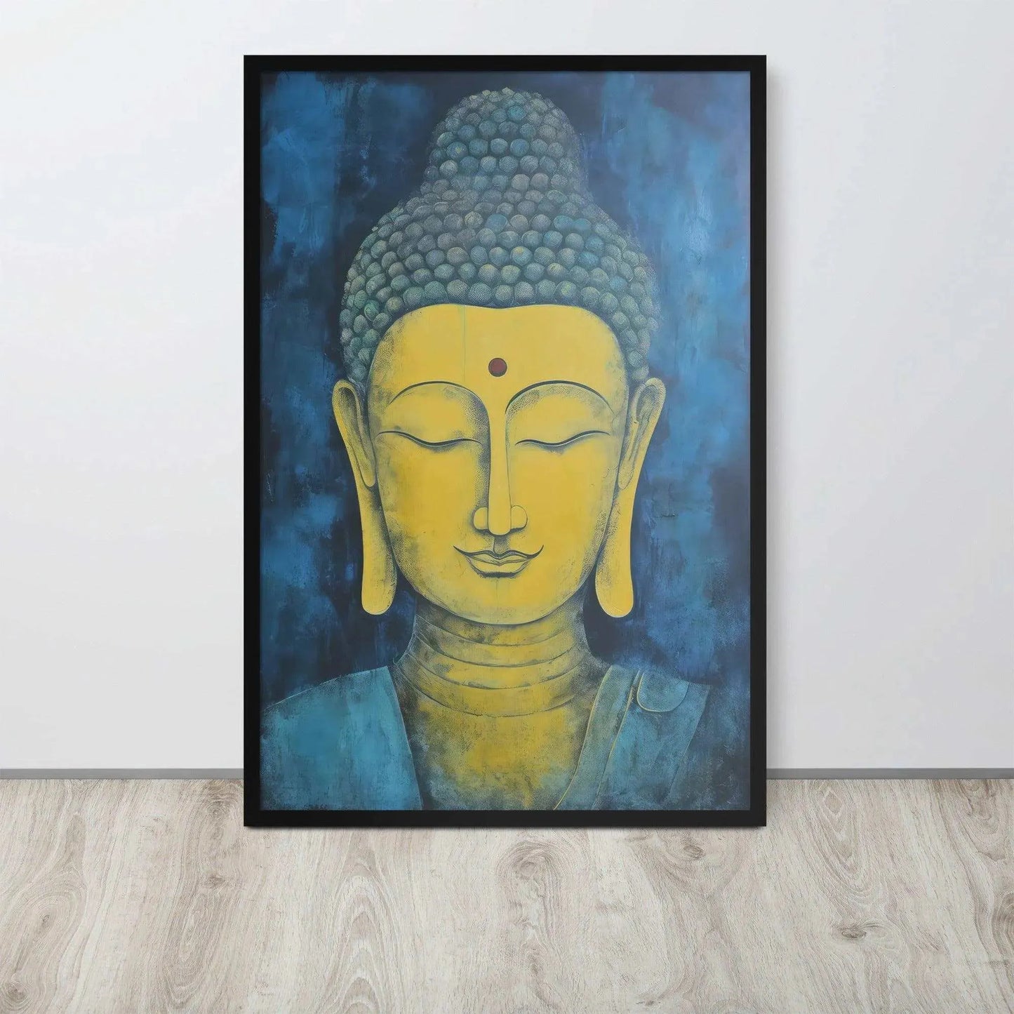 A black-Golden Happy Buddha Framed Print placed on a wooden floor against a white wall features a golden Buddha head with a serene expression, set against a deep blue textured background, creating a focal point of tranquility and spirituality in the room.