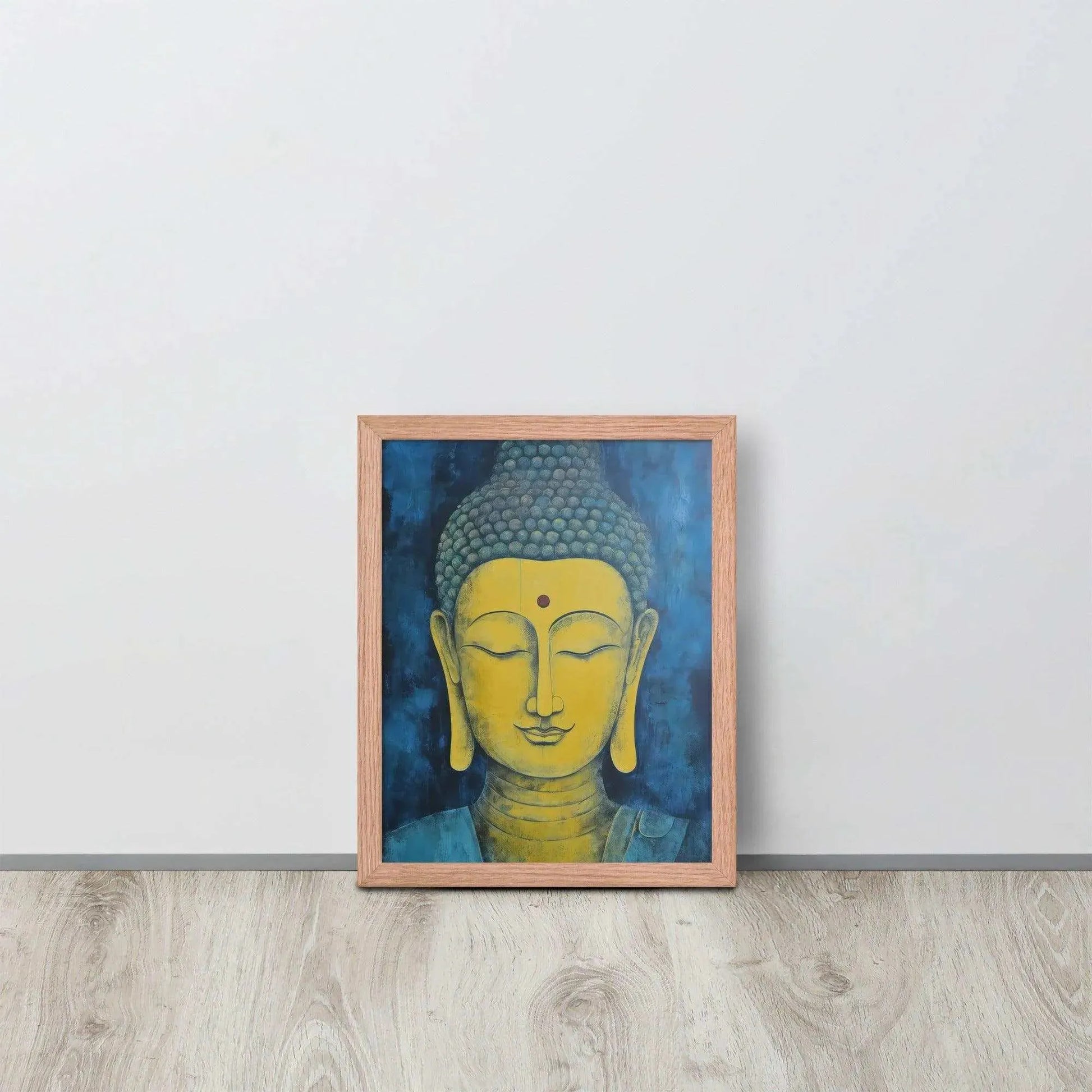 A red-Golden Happy Buddha Framed Print placed on a wooden floor against a white wall features a golden Buddha head with a serene expression, set against a deep blue textured background, creating a focal point of tranquility and spirituality in the room.