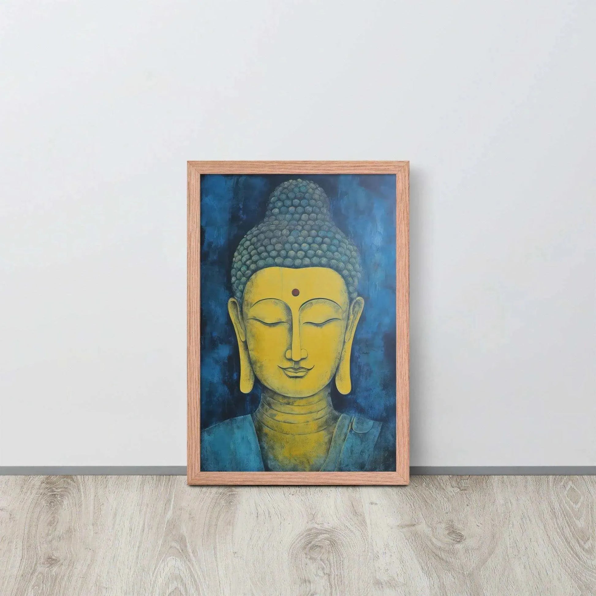 A red-Golden Happy Buddha Framed Print placed on a wooden floor against a white wall features a golden Buddha head with a serene expression, set against a deep blue textured background, creating a focal point of tranquility and spirituality in the room.