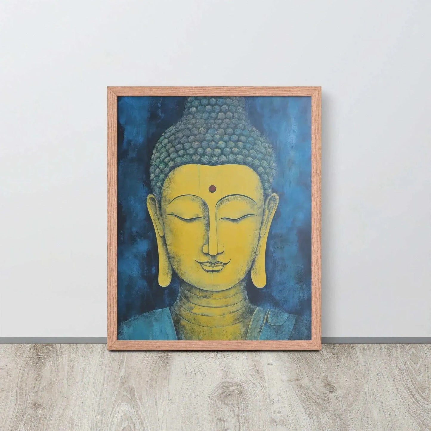 A red-Golden Happy Buddha Framed Print placed on a wooden floor against a white wall features a golden Buddha head with a serene expression, set against a deep blue textured background, creating a focal point of tranquility and spirituality in the room.