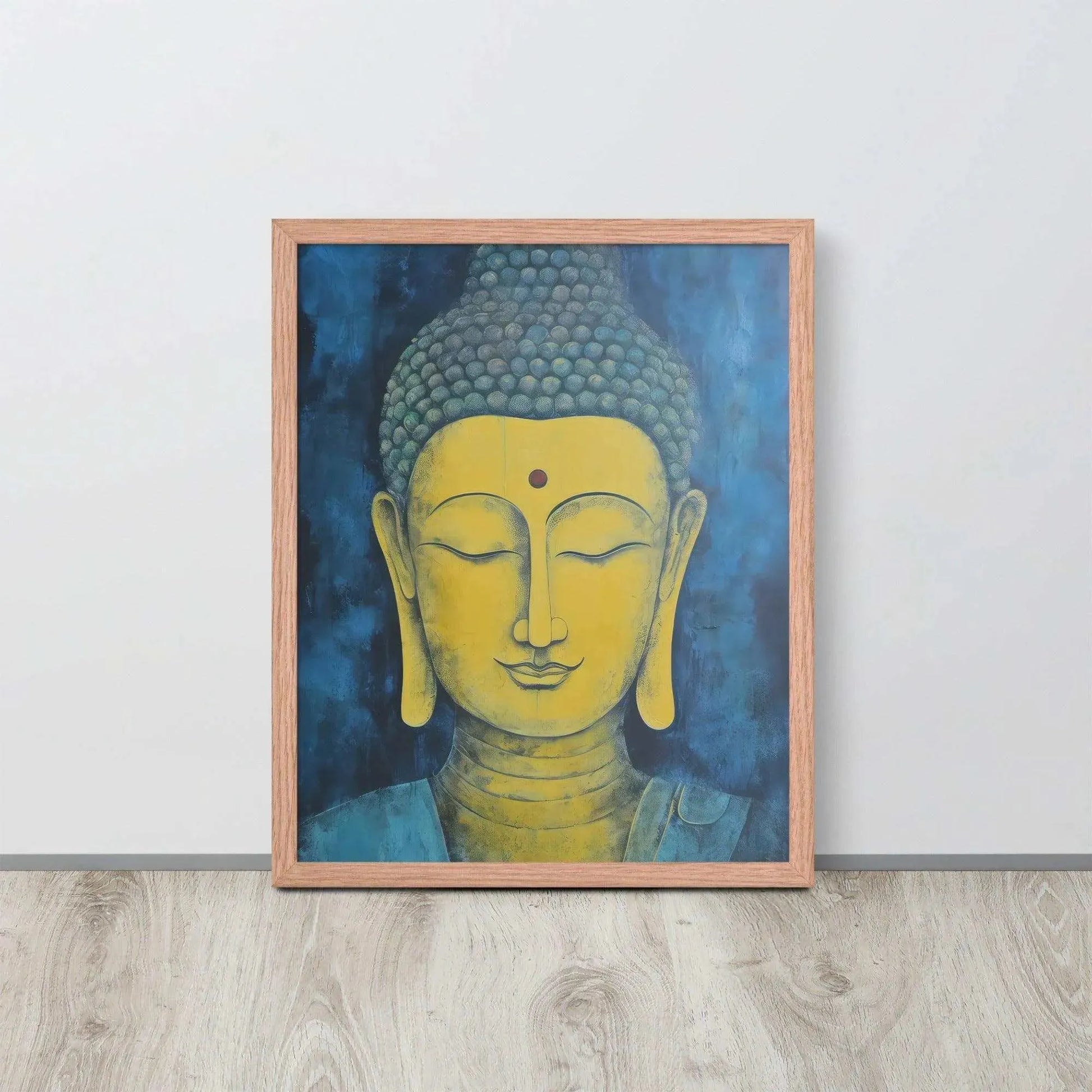 A red-Golden Happy Buddha Framed Print placed on a wooden floor against a white wall features a golden Buddha head with a serene expression, set against a deep blue textured background, creating a focal point of tranquility and spirituality in the room.