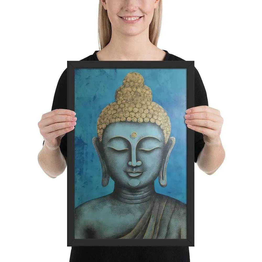 A beaming woman is holding a black-Happy Buddha Framed Print that features a Buddha head painted in shades of blue and gold against a textured blue background, exemplifying a fusion of traditional iconography with a modern artistic twist.