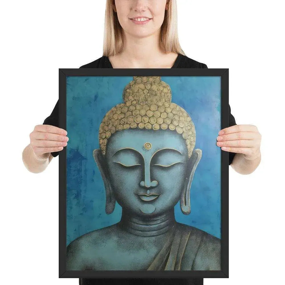 A beaming woman is holding a black-Happy Buddha Framed Print that features a Buddha head painted in shades of blue and gold against a textured blue background, exemplifying a fusion of traditional iconography with a modern artistic twist.