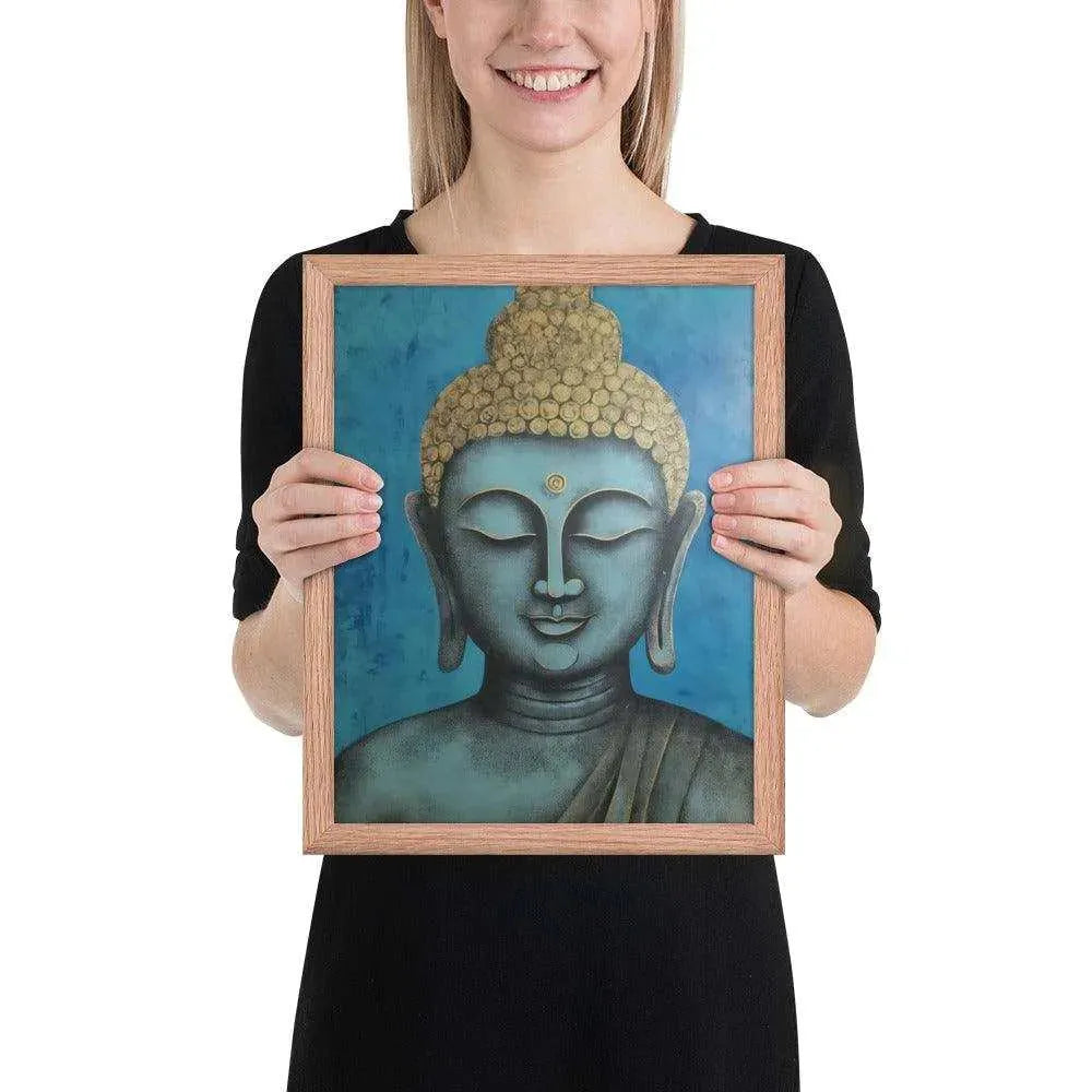 A beaming woman is holding a red-Happy Buddha Framed Print that features a Buddha head painted in shades of blue and gold against a textured blue background, exemplifying a fusion of traditional iconography with a modern artistic twist.