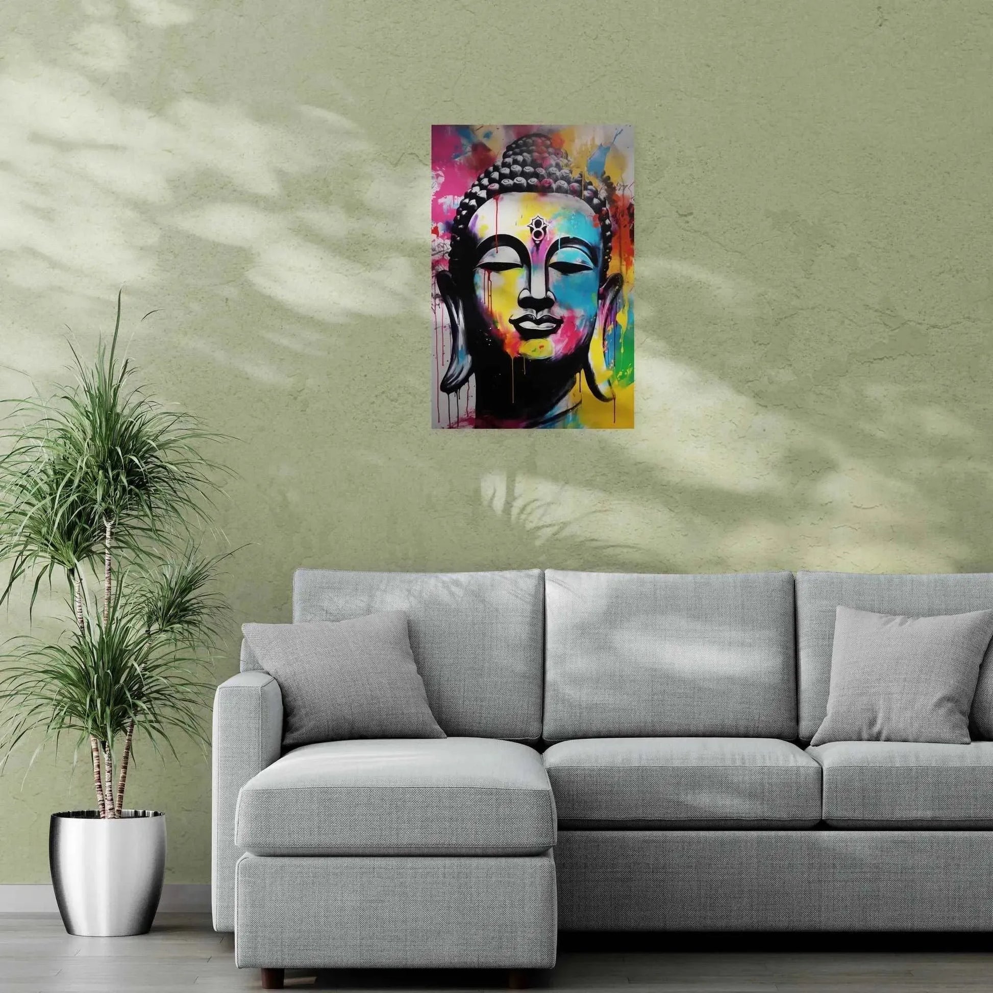 A colorful Buddha portrait in abstract style hangs on a wall with delicate leaf patterns, enhancing the zen-like ambiance of a living area with a cozy gray couch.