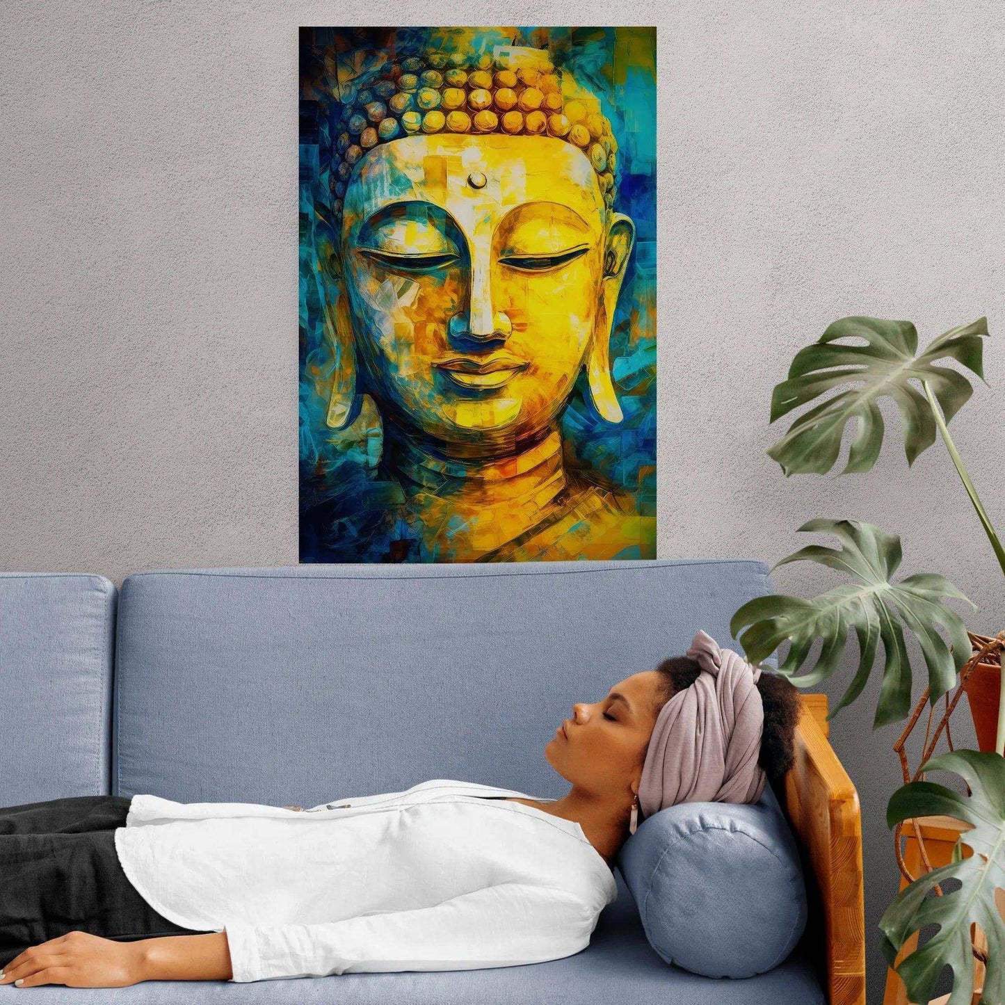 A serene space featuring a vibrantly painted Buddha portrait in rich hues of yellow and blue, displayed over a blue sofa where a woman rests peacefully, with lush green plants adding a touch of vitality to the room.