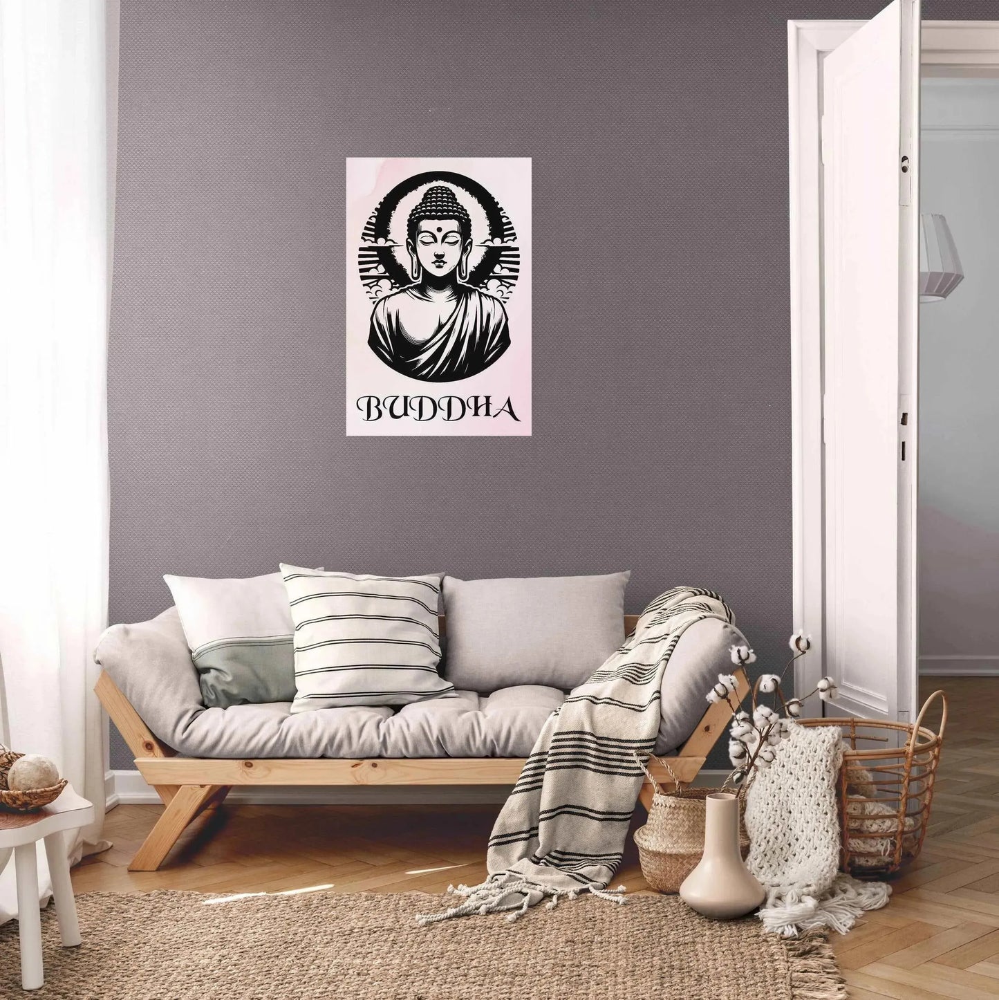 A cozy, stylish living room exudes spiritual serenity with a gray wall adorned by the "Timeless Buddha Poster" from Printify. The cushioned wooden sofa, accented with striped pillows and a blanket, is paired with a small table that holds a wicker basket. A woven rug further enhances mindfulness as natural light streams in from the adjacent room.