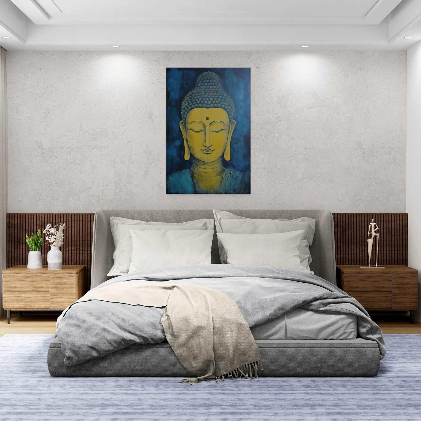 Modern bedroom featuring a Buddha head painting above a gray bed with a wooden side table, textured walls, and soft lighting.