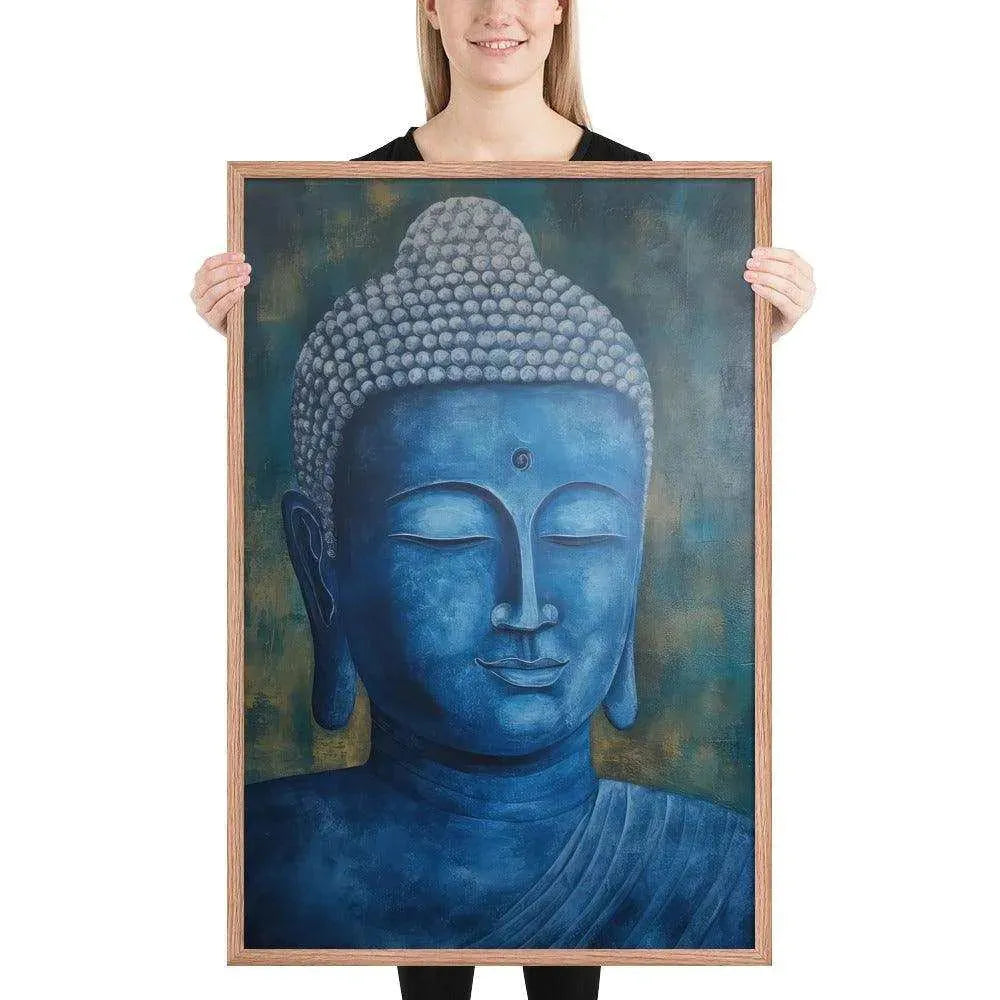 A smiling woman in a black top is displaying a red oak framed poster featuring a serene, monochromatic blue Buddha head with a textured background that adds depth to the peaceful visage.