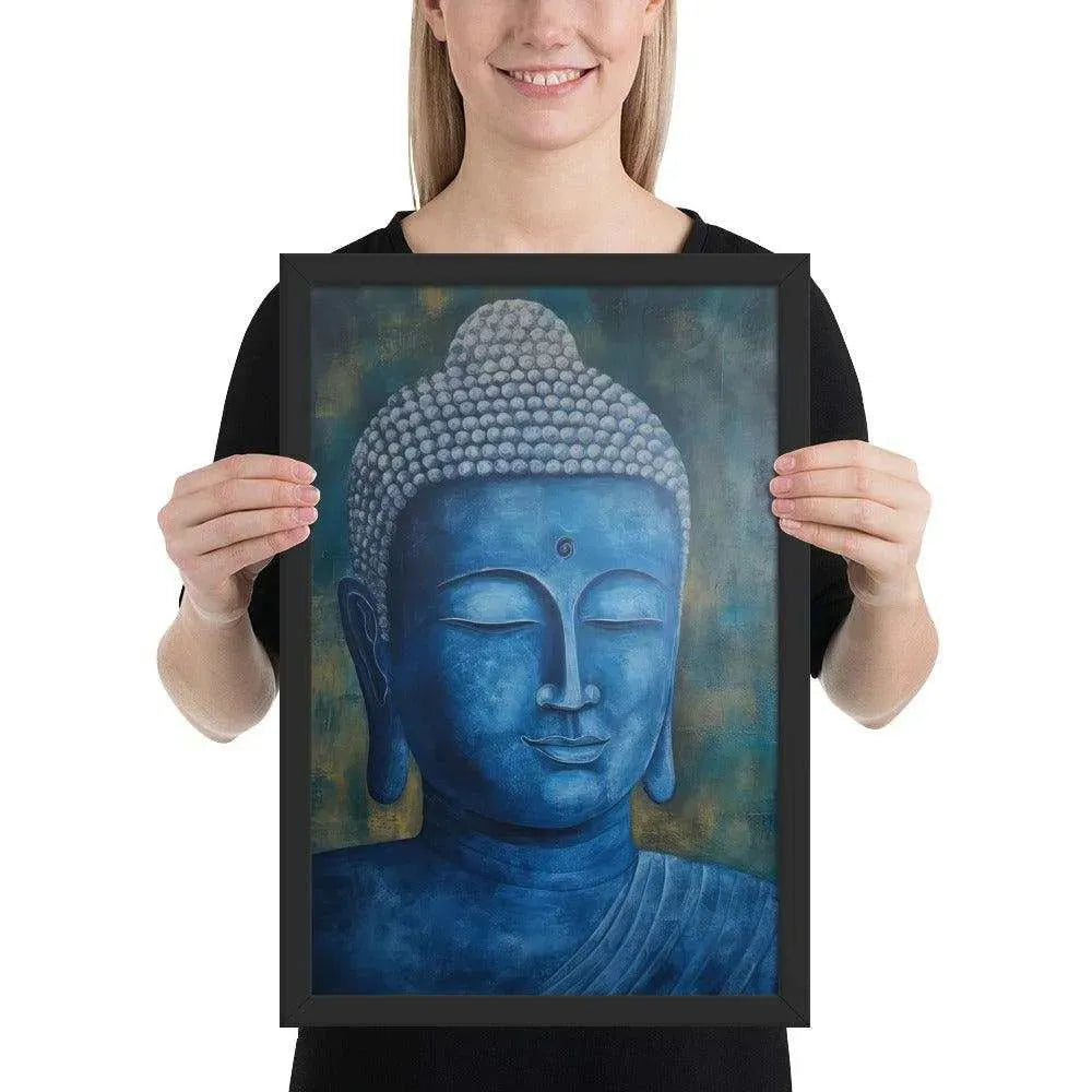 A smiling woman in a black top is displaying a black oak framed poster featuring a serene, monochromatic Blue Buddha Healing Art with a textured background that adds depth to the peaceful visage.