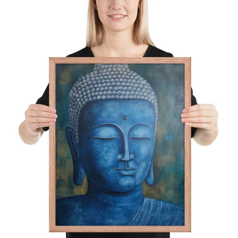 A smiling woman in a black top is displaying a red oak framed poster featuring a serene, monochromatic blue Buddha head with a textured background that adds depth to the peaceful visage.